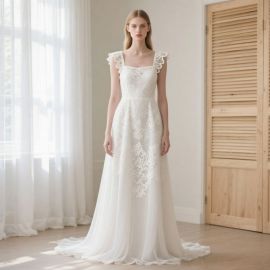 Elegant Ivory A - Line Wedding Dress with Lace Appliqué & Ruffled Straps